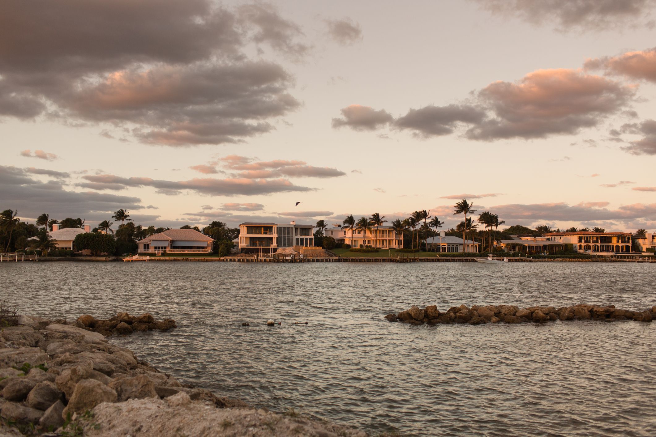 Tropical palm trees and ocean views at sunset in Jupiter Island.