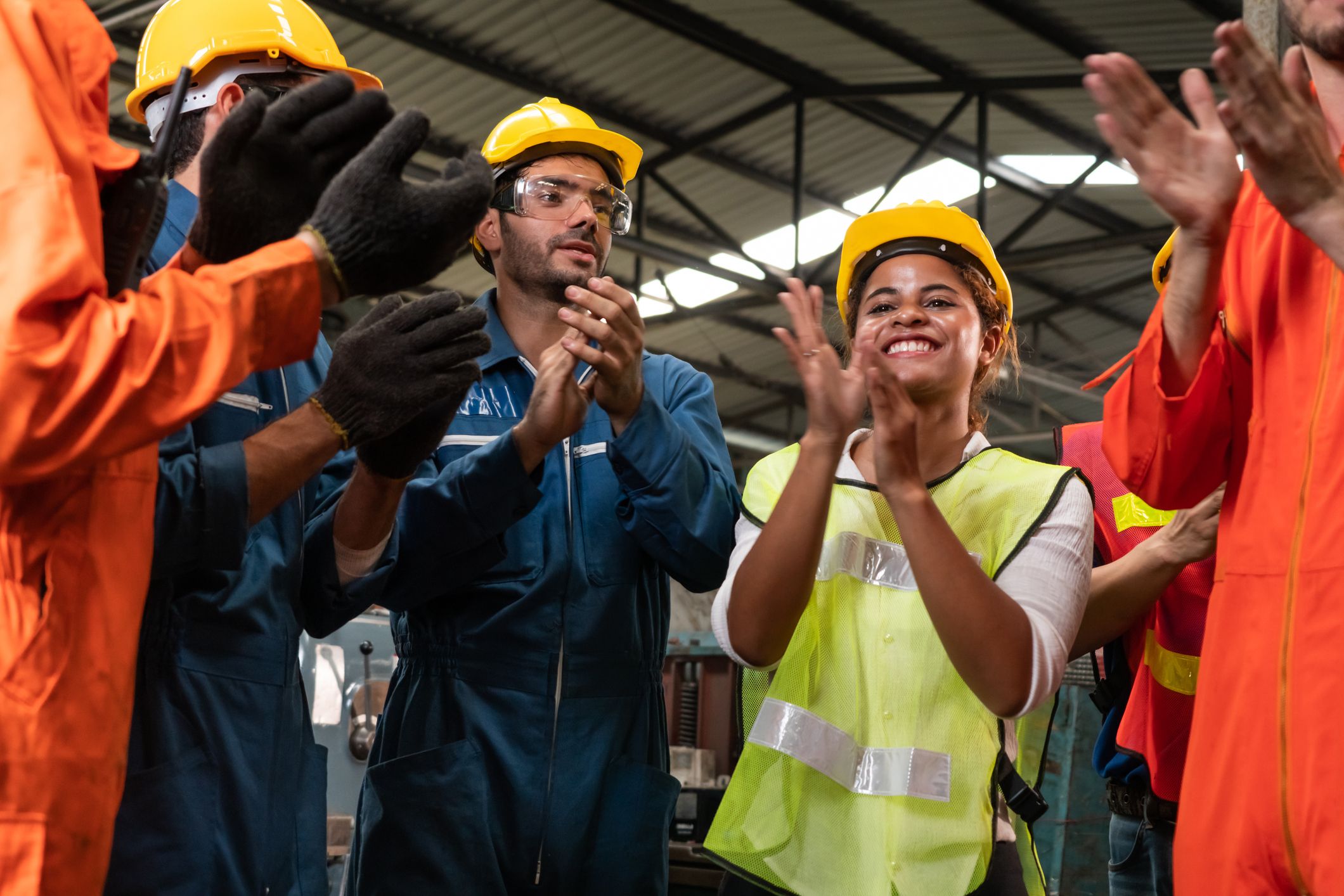 Workers celebrate a success in their factory.